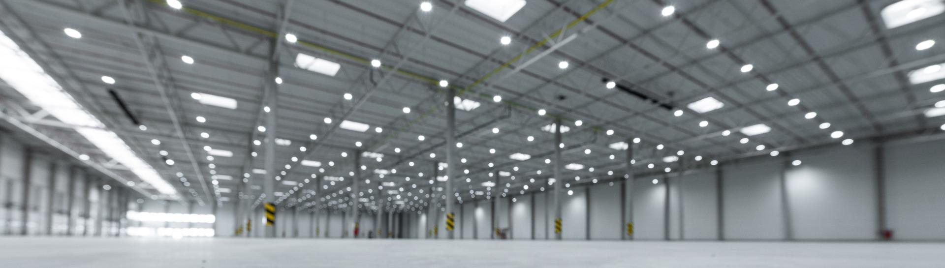 an empty warehouse with bright lighting