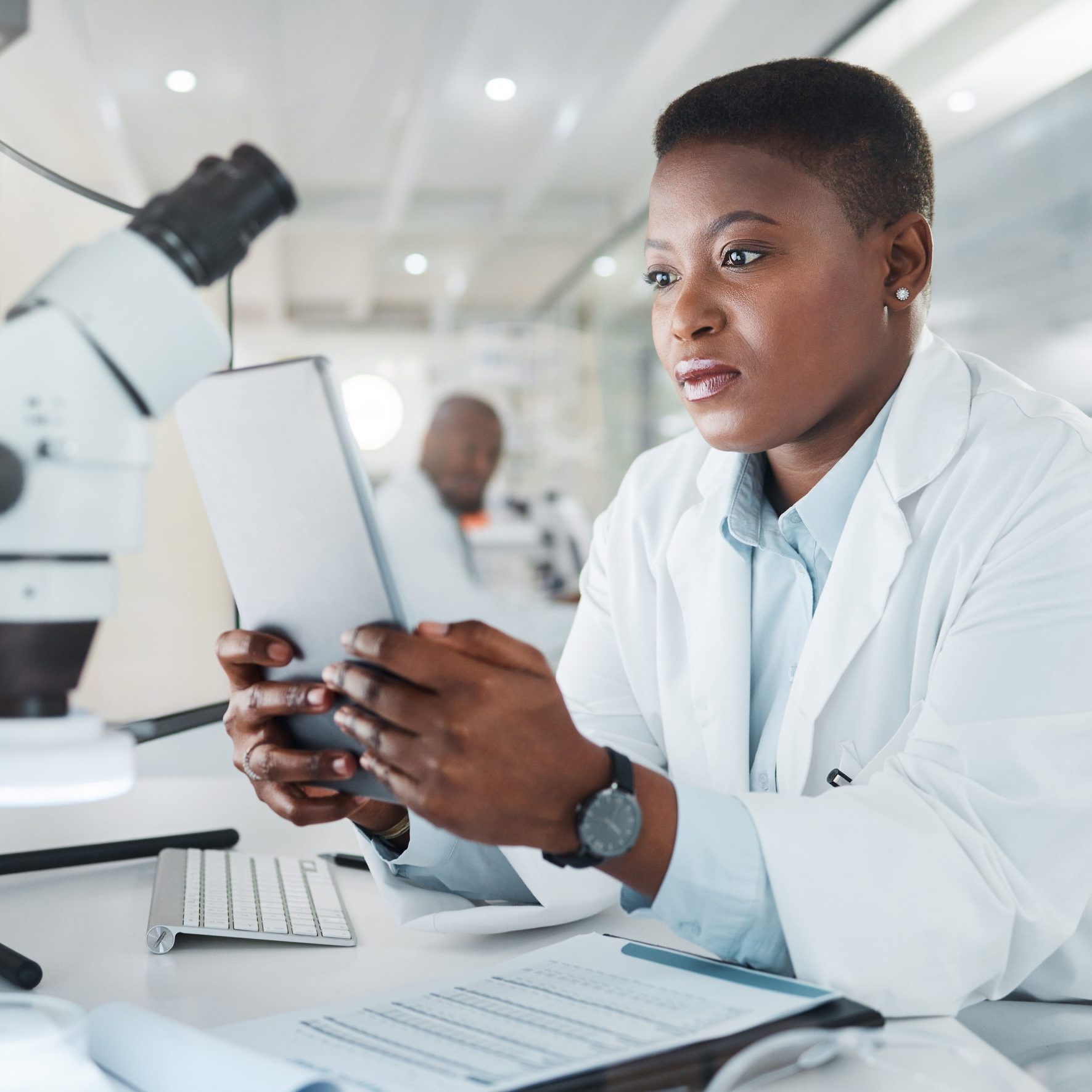 Shot of a young scientist using a digital tablet while working in a lab.
